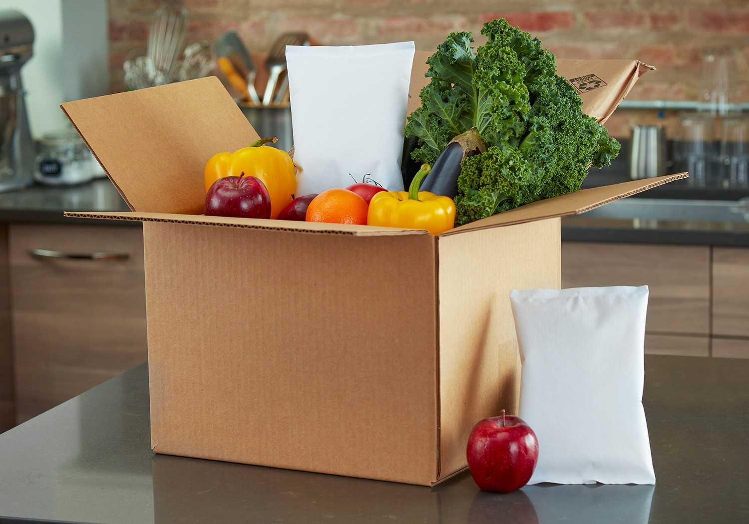 a picture of moisture guard gel packs with a fruits and vegetables delivery box