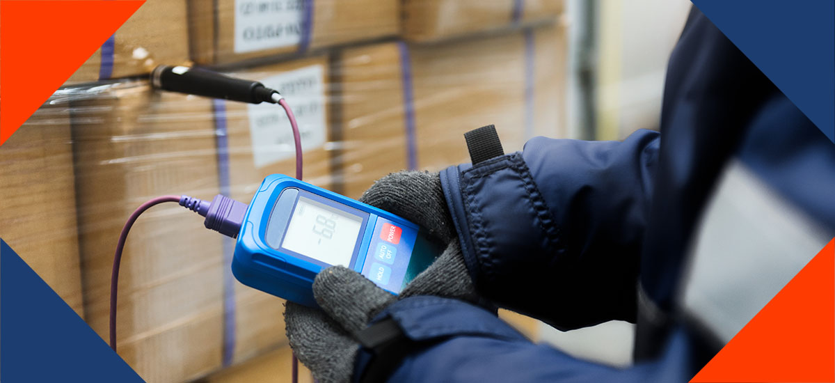 Man Checking On Temp Of Cold Shipping